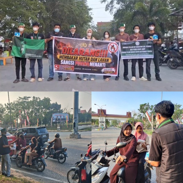 Peduli Warga Terdampak Asap Karhutla, HMI Pelalawan dan Polisi Bagikan 2.000 Masker Gratis