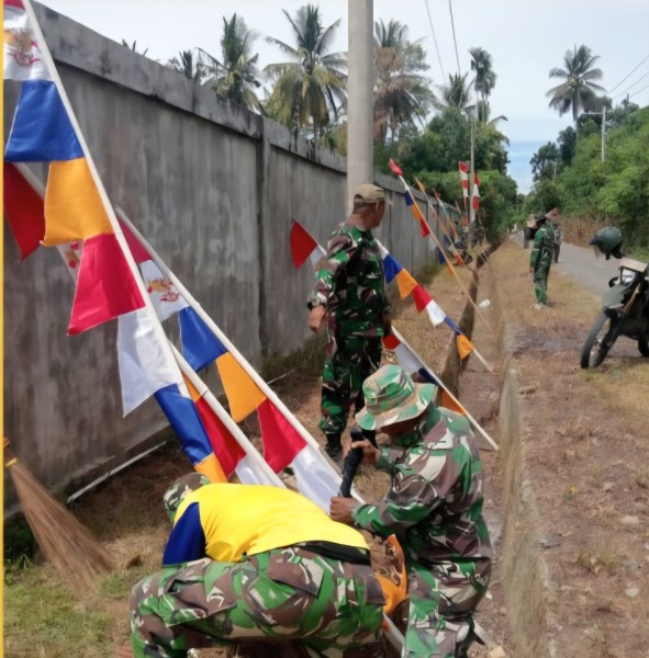 Semarak Jelang Pembukaan TMMD Ke-129, Personel Satgas Percantik Desa Lhok Panah dengan Umbul-Umbul